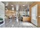 Open living space featuring modern lighting fixtures and access to the kitchen at 3106 Lila St, Tampa, FL 33610
