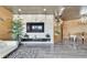 Spacious living room with a large TV, modern decor, and stylish furniture at 3106 Lila St, Tampa, FL 33610