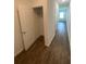 Walk-in closet with wood floors and plenty of storage space at 35220 White Water Lily Way, Zephyrhills, FL 33541