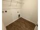 Empty closet with vinyl floors and wire shelving at 35220 White Water Lily Way, Zephyrhills, FL 33541
