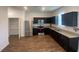 Modern kitchen featuring stainless steel appliances and granite countertops at 35220 White Water Lily Way, Zephyrhills, FL 33541