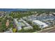 Aerial shot of a residential community showcasing mature trees, water views, and modern buildings at 3824 37Th S St # 65, St Petersburg, FL 33711