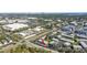 An aerial view of the property shows its location near commercial areas and a distant cityscape at 3824 37Th S St # 65, St Petersburg, FL 33711
