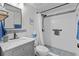 Updated bathroom featuring a modern vanity, tiled shower with a rainfall showerhead, and stylish accents at 3824 37Th S St # 65, St Petersburg, FL 33711