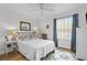 Serene bedroom with a cozy rug, featuring a decorative headboard, soft lighting and ample natural light at 3824 37Th S St # 65, St Petersburg, FL 33711