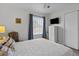 Comfortable bedroom with a ceiling fan, offers a calming retreat with soft lighting and a window view at 3824 37Th S St # 65, St Petersburg, FL 33711