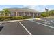 Clubhouse exterior featuring patriotic decor and accessible parking for residents and guests at 3824 37Th S St # 65, St Petersburg, FL 33711