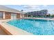 Inviting community pool surrounded by lounge chairs and well-maintained landscaping for relaxation and enjoyment at 3824 37Th S St # 65, St Petersburg, FL 33711