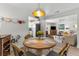 Comfortable dining area with hardwood floors, an attractive light fixture, and an open layout at 3824 37Th S St # 65, St Petersburg, FL 33711