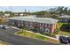 A two-story brick condo building shows parking and landscaping at 3824 37Th S St # 65, St Petersburg, FL 33711