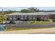 Attractive condo complex with brick facade and well-maintained landscaping and parking spaces at 3824 37Th S St # 65, St Petersburg, FL 33711