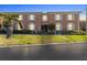 Charming two-story brick condo with well-manicured landscaping and a beautiful palm tree in the front yard at 3824 37Th S St # 65, St Petersburg, FL 33711