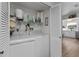 Convenient laundry area with washer, dryer, and shelving, providing practical storage and organization at 3824 37Th S St # 65, St Petersburg, FL 33711