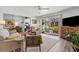 Inviting condo living room with hardwood floors, sliding glass doors to the patio, and an open concept design at 3824 37Th S St # 65, St Petersburg, FL 33711