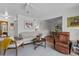 Stylish condo living room showcasing neutral decor, hardwood floors, and an open flow into the dining area at 3824 37Th S St # 65, St Petersburg, FL 33711