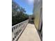 Open air balcony is spacious with a secure railing at 415 Bayou Village Dr, Tarpon Springs, FL 34689