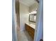 Bathroom featuring tile floors, vanity with sink, and separate shower area at 415 Bayou Village Dr, Tarpon Springs, FL 34689