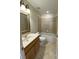 Bathroom with a vanity and a shower over bath at 415 Bayou Village Dr, Tarpon Springs, FL 34689