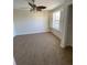 Bedroom featuring neutral walls, carpet, ceiling fan, and natural light at 415 Bayou Village Dr, Tarpon Springs, FL 34689