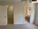 Bedroom showcasing a walk-in closet and an en-suite bathroom at 415 Bayou Village Dr, Tarpon Springs, FL 34689