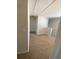 Loft hallway with carpeted floors and neutral walls at 415 Bayou Village Dr, Tarpon Springs, FL 34689