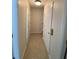Hallway features tile flooring and neutral walls and trim at 415 Bayou Village Dr, Tarpon Springs, FL 34689