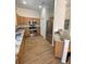 Well-equipped kitchen with granite countertops, stainless steel appliances, and wood floors at 415 Bayou Village Dr, Tarpon Springs, FL 34689