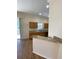 Open kitchen featuring wood floors, granite countertops, and stainless steel sink at 415 Bayou Village Dr, Tarpon Springs, FL 34689