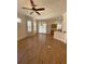 Inviting living room space featuring wood flooring, and an open layout at 415 Bayou Village Dr, Tarpon Springs, FL 34689