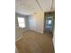 Loft area featuring carpet, a window, and access to a closet at 415 Bayou Village Dr, Tarpon Springs, FL 34689
