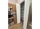 Kitchen featuring stainless steel appliances, granite countertops, and walk-in pantry at 415 Bayou Village Dr, Tarpon Springs, FL 34689