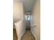 Carpeted staircase leads up past the shutters to the upper floor at 415 Bayou Village Dr, Tarpon Springs, FL 34689