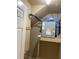 Utility room containing electrical panel and storage space at 415 Bayou Village Dr, Tarpon Springs, FL 34689