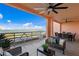 Relaxing outdoor balcony with comfortable seating and dining furniture overlooking the tranquil bay waters at 4951 Bacopa S Ln # 103, St Petersburg, FL 33715