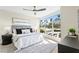 Bright bedroom with large window and neutral decor at 4951 Bacopa S Ln # 103, St Petersburg, FL 33715