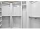 Spacious walk-in closet with custom shelving and plenty of storage at 4951 Bacopa S Ln # 103, St Petersburg, FL 33715
