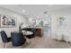 Bright dining area with modern table and chairs next to a luxury kitchen at 4951 Bacopa S Ln # 103, St Petersburg, FL 33715