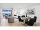 Open living room with hardwood floors, dining space and water view at 4951 Bacopa S Ln # 103, St Petersburg, FL 33715