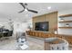 Modern living room with wood paneling and floating shelves, perfect for relaxation at 4951 Bacopa S Ln # 103, St Petersburg, FL 33715