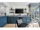 This living room features a wine bar, wine fridge, stylish counters, and floating shelves at 4951 Bacopa S Ln # 103, St Petersburg, FL 33715