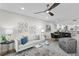 Bright living room with an open floor plan, contemporary decor, and views of the modern kitchen at 4951 Bacopa S Ln # 103, St Petersburg, FL 33715