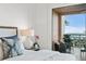 Close up of main bedroom decor, including a water view at 4951 Bacopa S Ln # 103, St Petersburg, FL 33715