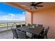 Outdoor patio with comfortable seating, a table for six, and a panoramic view of the bay at 4951 Bacopa S Ln # 103, St Petersburg, FL 33715