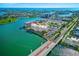 Aerial view of the condo complex and surrounding waterfront community and bridge at 500 Treasure Island Cswy # 308, Treasure Island, FL 33706