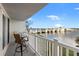 Balcony view with table and chairs overlooking bridge and the bay at 500 Treasure Island Cswy # 308, Treasure Island, FL 33706