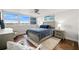 Inviting bedroom with a comfortable bed, scenic views, and stylish décor at 500 Treasure Island Cswy # 308, Treasure Island, FL 33706