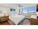 Bright bedroom with a cozy rug, stylish furnishings, and picturesque waterfront views at 500 Treasure Island Cswy # 308, Treasure Island, FL 33706