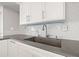Bright kitchen features concrete sink, white subway tile backsplash, and white cabinets with brushed metal hardware at 500 Treasure Island Cswy # 308, Treasure Island, FL 33706