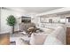 Comfortable living room with neutral tones, modern furniture, and a view into the adjacent kitchen at 500 Treasure Island Cswy # 308, Treasure Island, FL 33706