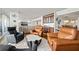 Elegant living room with comfortable seating, a view of the bar area, and access to outdoor space at 500 Treasure Island Cswy # 308, Treasure Island, FL 33706